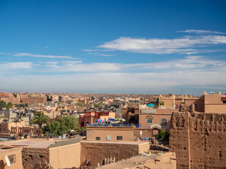 Taourirt Kasbah, Ouarzazate, Morocco, North Africa [Moroccan mountain landscape, old ancient Taourirt Kasbah castle fortress, street and buildings with kids and market]