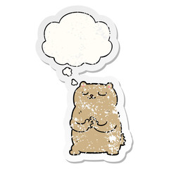 cartoon bear and thought bubble as a distressed worn sticker