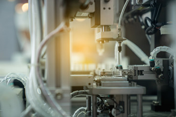 automation machine and detail close up in machine automatic with robotic automation technology for technology production factory