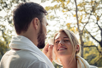 Fototapeta premium Young couples are wiping sweat after exercising.