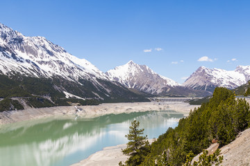 Naklejka na ściany i meble Alpine landscape with artificial lake, italy