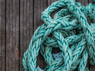Sailing background -Blue grunge rope on wood background with copy space