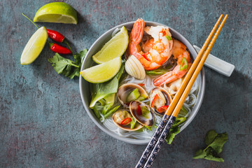 Noodles with shrimps and clams, spicy asian style bowl.	
