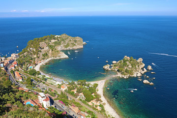Beautiful aerial view of Taormina, Italy. Sicilian seascape with Isola Bella island and beach.