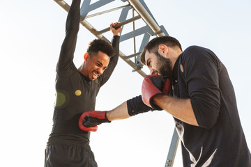 Two attractive young healthy sportsmen outdoors © Drobot Dean