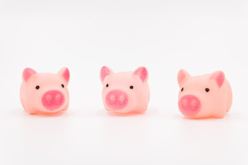 Three little pig fairy tales, three pink cute toy piglets neatly arranged on a white background