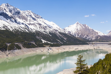 Fototapeta na wymiar Alpine landscape with artificial lake, italy