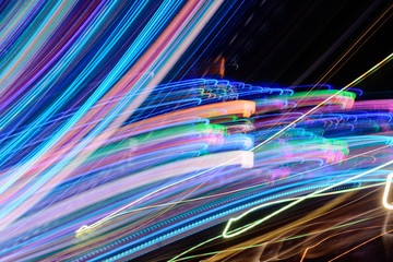 Abstract background of night light on street. Multicolored striped lines in motion made from  lighting effect ,Light trails over black long exposure shot concept.