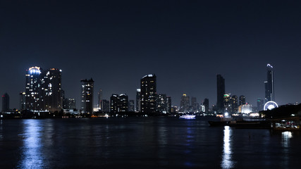 Fototapeta premium Building at night river Bangkok, Thailand. Cityscape concept.