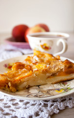 Homemade baked slice fruit berry tart, pie or cake on plate with cotton napkin. Holyday concept