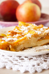 Homemade baked slice fruit berry tart, pie or cake on plate with cotton napkin. Holyday concept