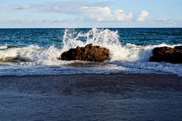 waves crashing on rocks