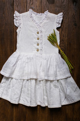 Fototapeta na wymiar Baby linen dress, retro style, natural fabric