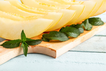 Melon slices on a cutting board