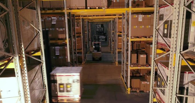 Workflow in a warehouse, active work in a warehouse, forklifts in a warehouse