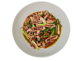 Thai Spicy stir fried squid isolate on white background with clipping path.