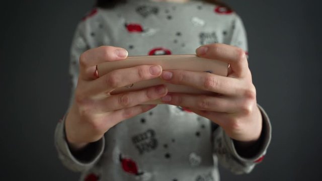 Close up of young teenage girl typing message on smartphone with smartphone text massage animation appearing . Close up female hands. Social network animation. Social media message.