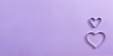 Valentine's day heart ornaments on a purple background