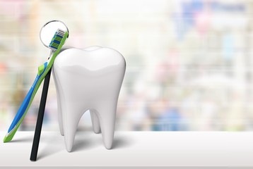 Big tooth model and toothbrush on light background