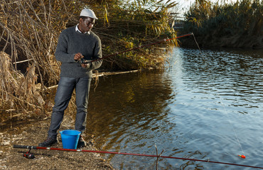 Man fishing with rods