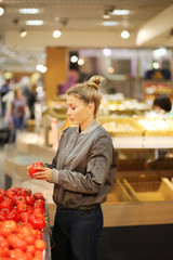 Woman buying vegetables at the market