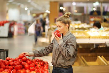 Woman buying vegetables at the market