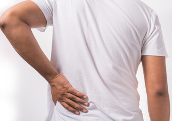 Young man suffering from lumbago