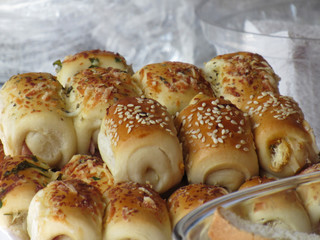 Cheese and Ham rolls covered in sesame seeds