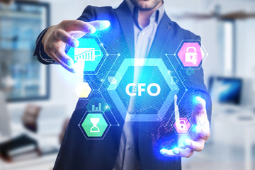 The concept of business, technology, the Internet and the network. A young entrepreneur working on a virtual screen of the future and sees the inscription: CFO