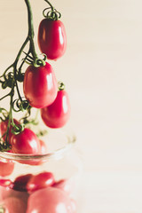 Close-uo of fresh tomatoes in the glass jar