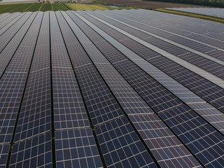 Aerial drone view Solar panels in the field, green alternative energy. Photo taken with an drone.