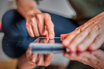 Woman hand writing anything on mobile phone