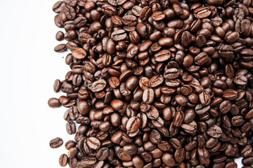 Closeup group of coffee bean on white background,blurry light around
