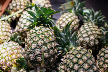 Fresh pineapples on stall in market