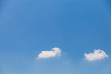 Tiny clouds on blue sky.