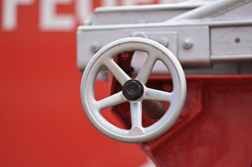 A wheel for an extendable ladder of an old fire truck.