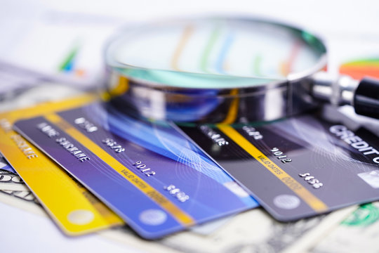 Credit card with Magnifying glass : Financial development, Accounting, Statistics, Investment Analytic research data economy office Business company banking concept.