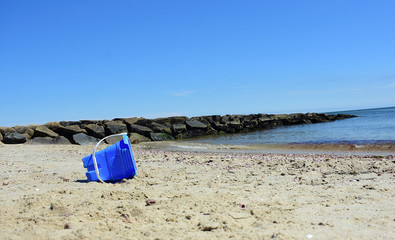 Kids Blue bucket on Cape Cod sandy beach
