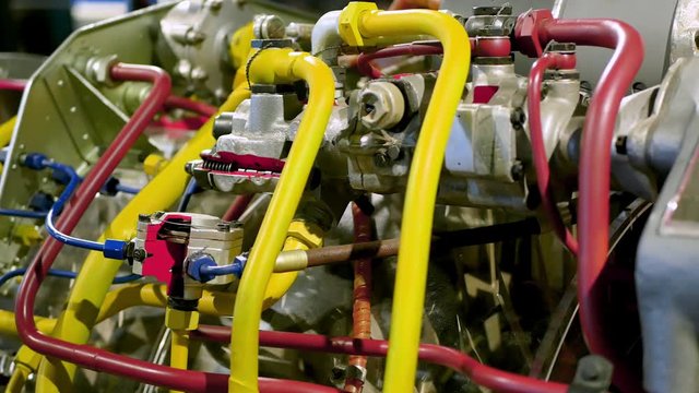 inside jet engine. Fuel tubes are painted in different colors. Jet engine inner mechanics, metal retro engineer concept, vehicle repair or technology texture