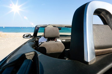 Fototapeta na wymiar Summer car on beach and sunny hot day. 