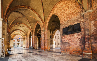 Fototapeta na wymiar Arcade of Palazzo Comunale (Gothic palace) in the center of Piacenza