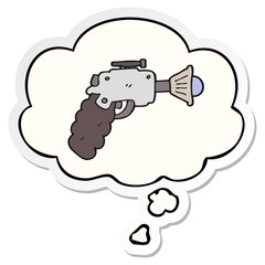 cartoon ray gun and thought bubble as a printed sticker