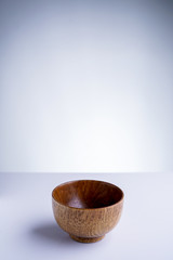 An empty japanese wooden rice bowl on white isolated background