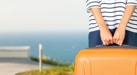 Young woman with travel bag