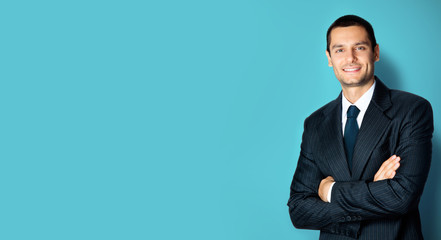 Picture of happy businessman with crossed arms