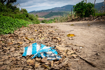 Decaying Plastic Bag discarded beside country road
