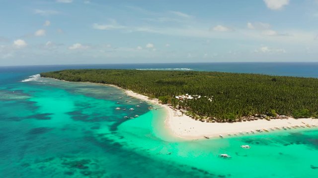 Travel concept: sandy beach on a tropical island by coral reef atoll from above. Daco island, Philippines. Summer and travel vacation concept