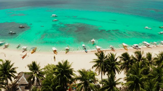 Tropical landscape: Daco island with beautiful beach, palm trees by turquoise water view from above. Siargao, Philippines. Summer and travel vacation concept