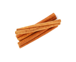 Close up three cinnamon sticks isolated on white