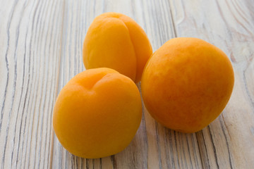 Apricot fruits group on the wooden background